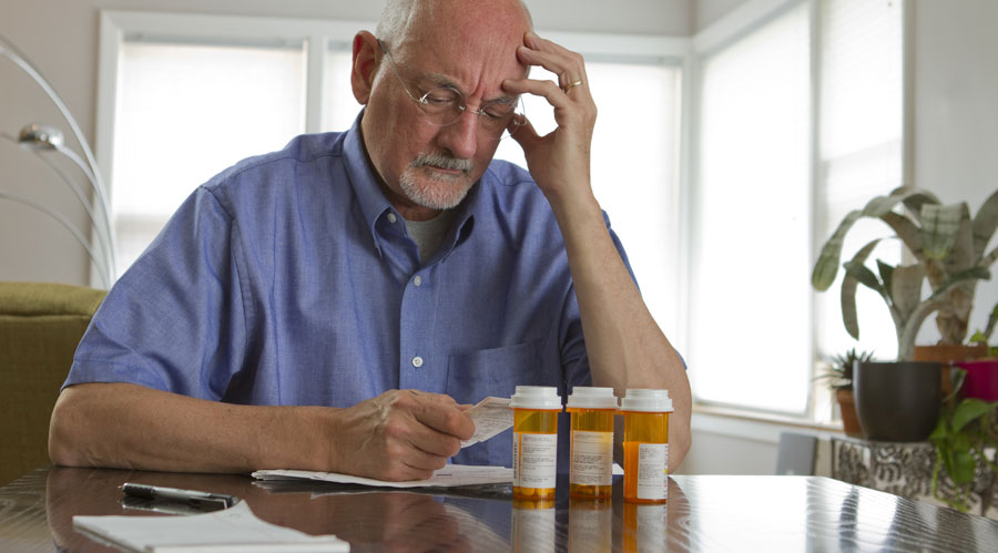 Elder man with medical bills