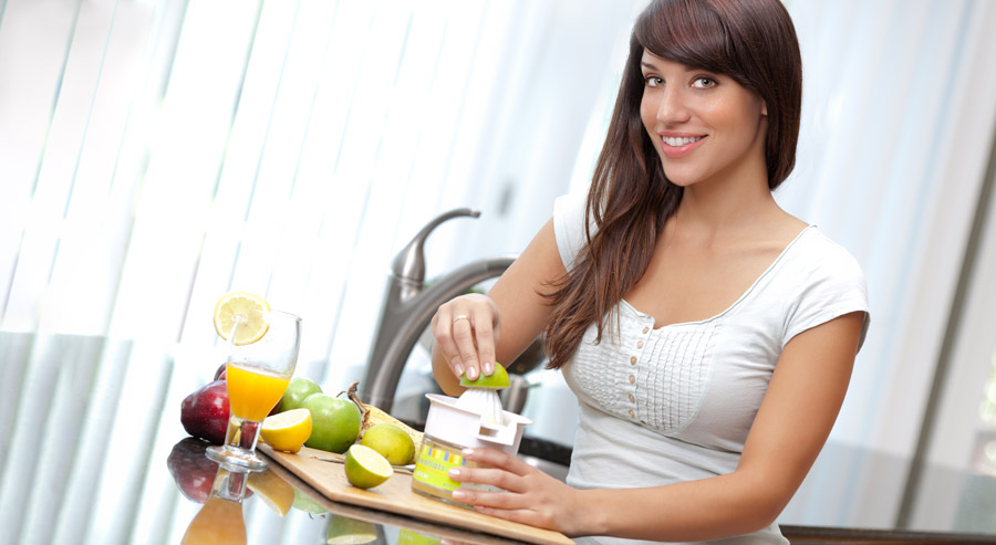 Lady making orange juice